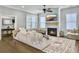 Comfortable living room with fireplace, ceiling fan, hardwood floors, and cozy decor at 1489 Red Tide Rd, Mount Pleasant, SC 29466