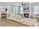 Cozy living room features a fireplace, TV, shiplap accent wall, and area rug at 1489 Red Tide Rd, Mount Pleasant, SC 29466