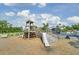 Community playground featuring a wooden structure with a slide, stairs, and lookout tower at 1489 Red Tide Rd, Mount Pleasant, SC 29466