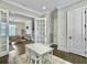 Bright playroom with a white table and chairs, light walls, and beautiful dark wood floors at 1489 Red Tide Rd, Mount Pleasant, SC 29466