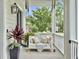 Cozy porch with a comfortable swing, perfect for relaxing and enjoying the neighborhood views at 1489 Red Tide Rd, Mount Pleasant, SC 29466