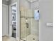 Elegant glass-enclosed shower with tiled walls and a view into the bedroom at 1489 Red Tide Rd, Mount Pleasant, SC 29466