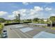 Well-maintained tennis courts with new nets surrounded by beautiful landscaping in a Gathering community at 1489 Red Tide Rd, Mount Pleasant, SC 29466