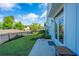 Lush backyard with a concrete patio, black fence, and a cozy hammock at 1515 Pogonia St # 2, Mount Pleasant, SC 29466