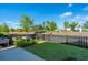 Green backyard with a black fence, grassy area, and raised garden beds at 1515 Pogonia St # 2, Mount Pleasant, SC 29466