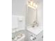 Bright bathroom featuring a modern vanity, mirror, lighting, and white cabinets at 1515 Pogonia St # 2, Mount Pleasant, SC 29466