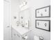 Bright bathroom with white fixtures, vanity, mirror, and modern lighting at 1515 Pogonia St # 2, Mount Pleasant, SC 29466