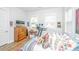 Charming bedroom with wood floors, multiple windows, and a dresser with a TV at 1515 Pogonia St # 2, Mount Pleasant, SC 29466