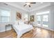 Bright bedroom with white walls, hardwood floors, and French doors to the backyard at 1515 Pogonia St # 2, Mount Pleasant, SC 29466