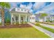 Attractive home with a well-kept lawn, appealing curb appeal, and a vibrant blue front door at 1515 Pogonia St # 2, Mount Pleasant, SC 29466