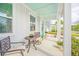 Inviting front porch with comfortable seating, plants, and a view of the street at 1515 Pogonia St # 2, Mount Pleasant, SC 29466