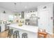 Modern kitchen featuring white cabinets, stainless steel appliances, and an island with seating at 1515 Pogonia St # 2, Mount Pleasant, SC 29466