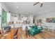 Bright living space adjacent to a modern kitchen with sleek appliances and island seating at 1515 Pogonia St # 2, Mount Pleasant, SC 29466