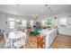 Open concept living space with a kitchen, dining area, and cozy living room at 1515 Pogonia St # 2, Mount Pleasant, SC 29466