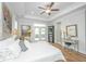 Cozy main bedroom with tray ceiling, hardwood floors, and access to the backyard at 1515 Pogonia St # 2, Mount Pleasant, SC 29466