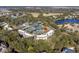 Scenic aerial view of a community featuring lush greenery, water features, and well-maintained tennis courts at 1605 Live Oak Park, Seabrook Island, SC 29455