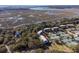Expansive aerial view showcasing tennis courts and marshland in a picturesque community setting at 1605 Live Oak Park, Seabrook Island, SC 29455