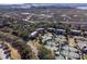 Stunning aerial perspective highlighting a community with tennis courts, lush trees and waterways at 1605 Live Oak Park, Seabrook Island, SC 29455