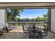 Charming balcony with comfortable seating and a view of the tennis courts at 1605 Live Oak Park, Seabrook Island, SC 29455