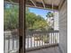 Private balcony with wooded views and a glimpse of the surrounding neighborhood at 1605 Live Oak Park, Seabrook Island, SC 29455