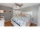 Comfortable bedroom with a coastal-themed decor, featuring a ceiling fan and white furnishings at 1605 Live Oak Park, Seabrook Island, SC 29455