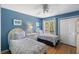 Cozy bedroom featuring two twin beds, hardwood floors, and a window with scenic views at 1605 Live Oak Park, Seabrook Island, SC 29455