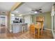 Open concept kitchen and dining area with granite countertops and stainless appliances at 1605 Live Oak Park, Seabrook Island, SC 29455