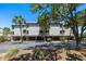 Coastal home with weathered wood and a covered area for parking under the house at 1605 Live Oak Park, Seabrook Island, SC 29455