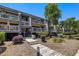 Inviting condo exterior featuring boardwalk, multiple decks, and lush landscaping at 1605 Live Oak Park, Seabrook Island, SC 29455