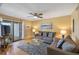 Comfortable living room with ceiling fan and balcony access at 1605 Live Oak Park, Seabrook Island, SC 29455