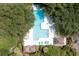 Aerial view of a large, inviting community pool surrounded by lush landscaping and plenty of lounge chairs at 1605 Live Oak Park, Seabrook Island, SC 29455