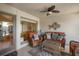 Inviting sunroom featuring cozy wicker furniture and a decorative fish wall hanging at 1605 Live Oak Park, Seabrook Island, SC 29455