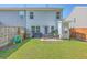 Spacious backyard featuring a patio with furniture, green lawn, and privacy fence for outdoor enjoyment at 163 Spencer Cir, Summerville, SC 29485
