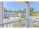 Scenic view of a charming neighborhood from a balcony, showcasing well-maintained homes and lush greenery at 163 Spencer Cir, Summerville, SC 29485