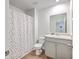 Well-lit bathroom featuring a vanity with storage, modern fixtures, and a shower with colorful curtain at 163 Spencer Cir, Summerville, SC 29485