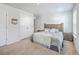 Neutral bedroom features a plush carpet, natural wood headboard and neutral bedding, offering a serene retreat at 163 Spencer Cir, Summerville, SC 29485