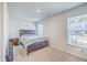 Cozy bedroom with large window and a comfortable bed with a padded headboard at 163 Spencer Cir, Summerville, SC 29485