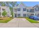 Charming two-story townhome with a welcoming entrance and a long driveway at 163 Spencer Cir, Summerville, SC 29485