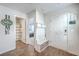 Bright foyer featuring a coat rack and access to the bathroom and main bedroom at 163 Spencer Cir, Summerville, SC 29485