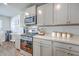 Stylish kitchen with stainless steel appliances, gray cabinets, and ample counter space for food preparation at 163 Spencer Cir, Summerville, SC 29485