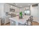 Modern kitchen with stainless steel appliances, a large island, and ample counter space for cooking at 163 Spencer Cir, Summerville, SC 29485