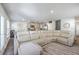 Open-concept living room and kitchen featuring a spacious layout and comfortable, reclining sectional sofa at 163 Spencer Cir, Summerville, SC 29485
