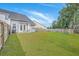 Spacious backyard features lush green grass, a privacy fence, and a patio area at 184 Kirkland St, Goose Creek, SC 29445