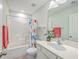Bright bathroom features a shower-tub combo and a large vanity sink at 184 Kirkland St, Goose Creek, SC 29445