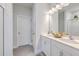 Bright bathroom with double vanity, white cabinetry, modern fixtures, and tile flooring at 184 Kirkland St, Goose Creek, SC 29445