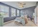 Serene bedroom boasts ample natural light, a ceiling fan, and stylish furnishings for a relaxing retreat at 184 Kirkland St, Goose Creek, SC 29445