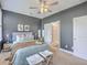 Bedroom with neutral walls, ceiling fan, and comfortable bed and easy access to ensuite bathroom at 184 Kirkland St, Goose Creek, SC 29445