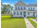Charming two-story home with manicured lawn and inviting entryway, great curb appeal at 184 Kirkland St, Goose Creek, SC 29445