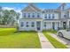 Attractive townhome featuring a lush green lawn and a paved walkway leading to the front door at 184 Kirkland St, Goose Creek, SC 29445