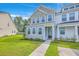 Inviting townhome with a well-kept lawn and sidewalk, showcasing its appealing exterior at 184 Kirkland St, Goose Creek, SC 29445